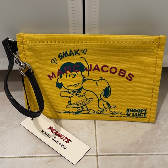 Marc Jacobs Handbags - NWT Marc Jacobs Yellow Snoopy & Lucy Canvas The Pouch Wristlet